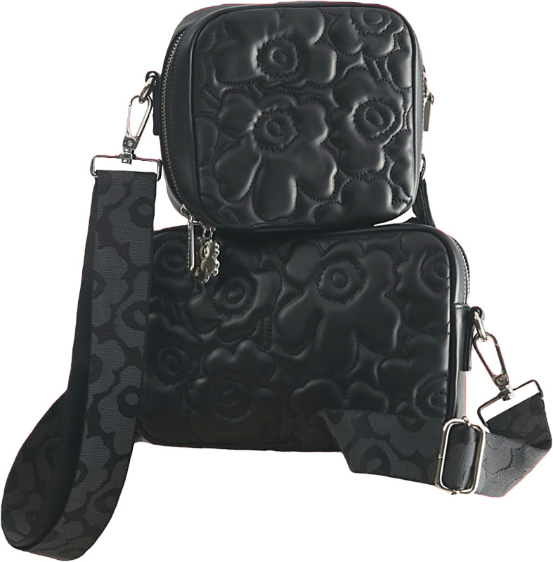 Nahkaiset olkalaukut, joko sileänä tai tikattuna Unikko-kuosilla.